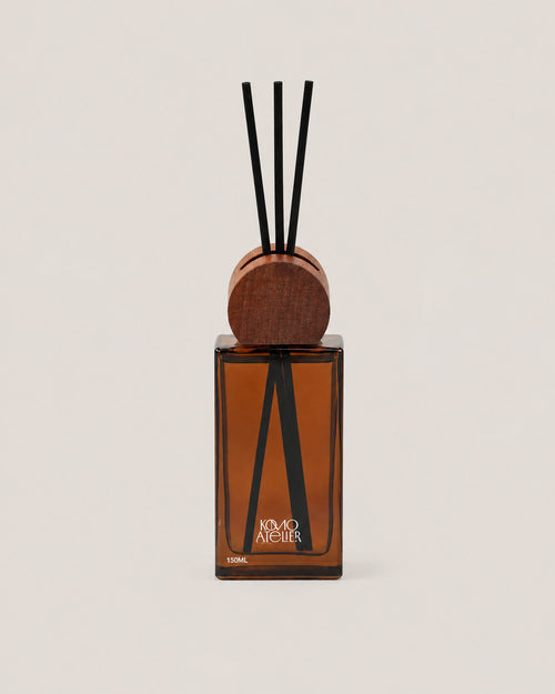 FORM II reed diffuser, architectural amber-tinted glass bottle