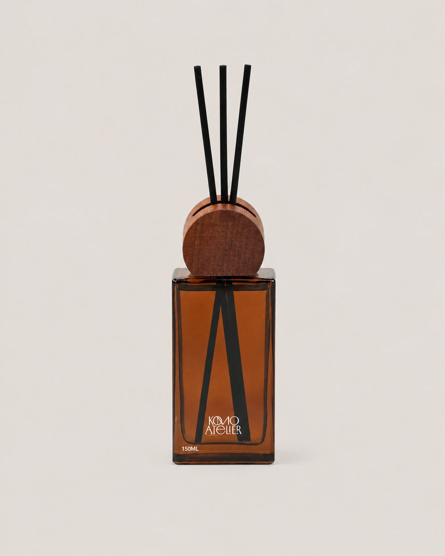 FORM II reed diffuser, architectural amber-tinted glass bottle