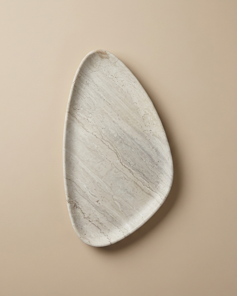 SURFACE II triangular stone tray in warm-toned travertine