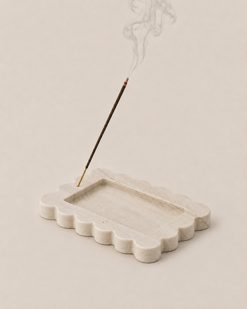 LINE incense holder, hand-carved travertine with a scalloped edge